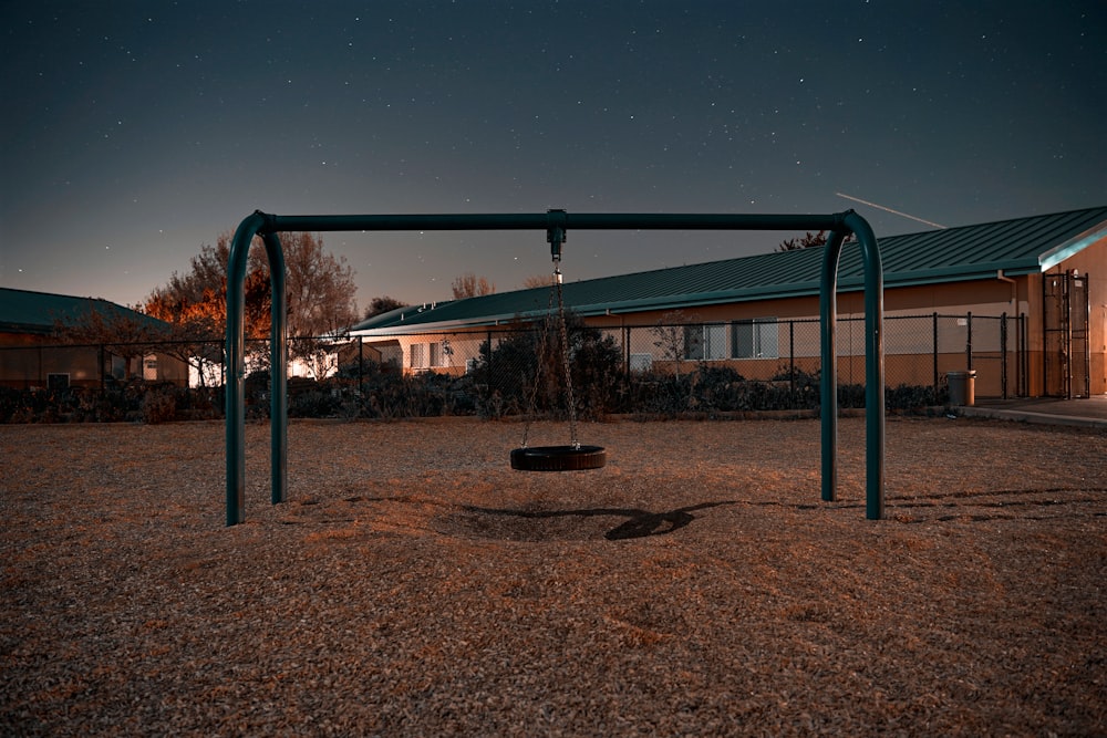 blue and brown playground under blue sky during daytime