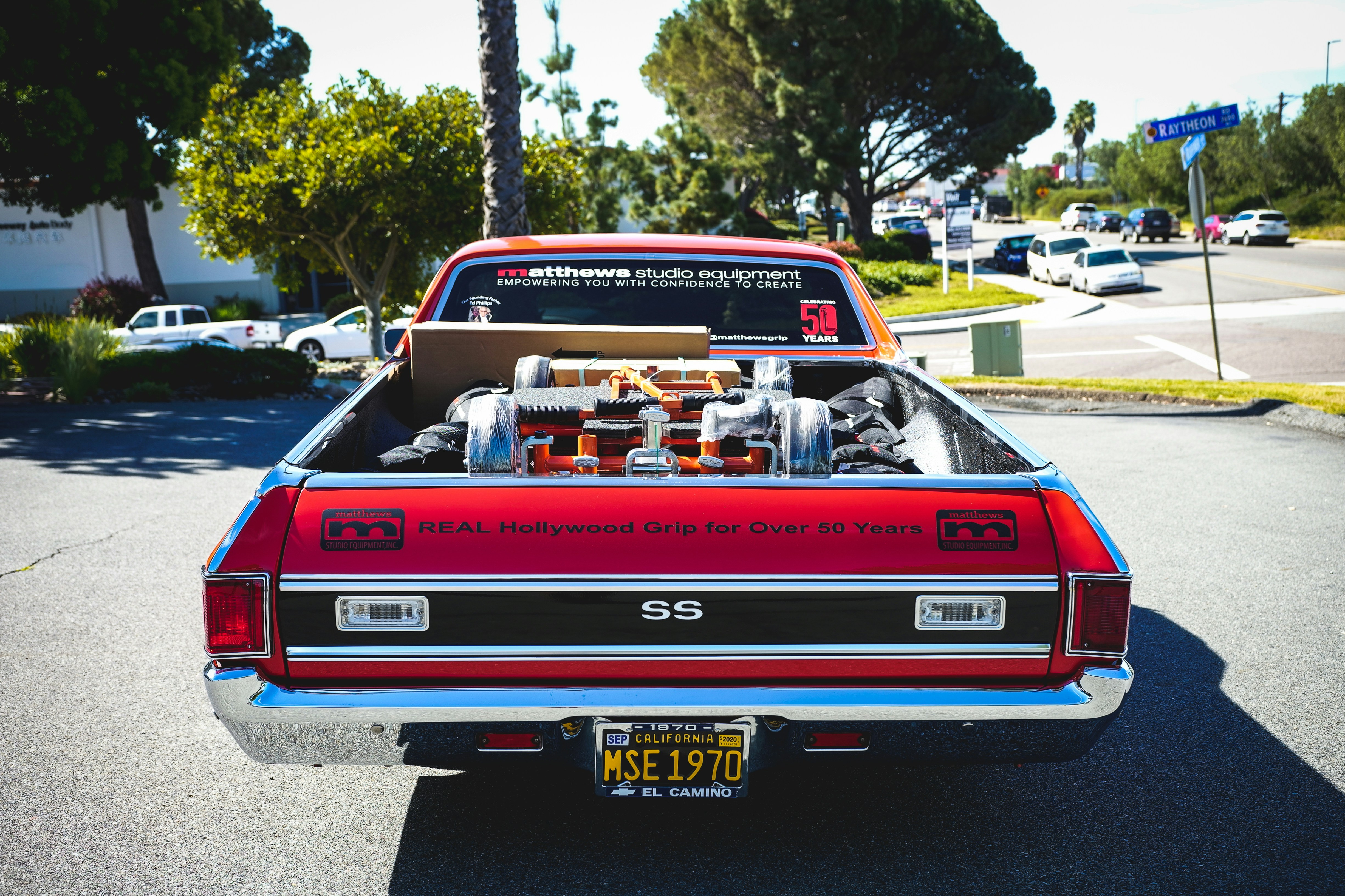 red chevrolet camaro on road during daytime
