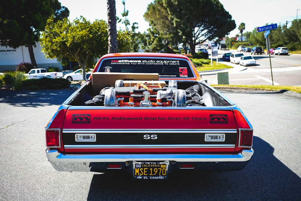 red chevrolet camaro on road during daytime