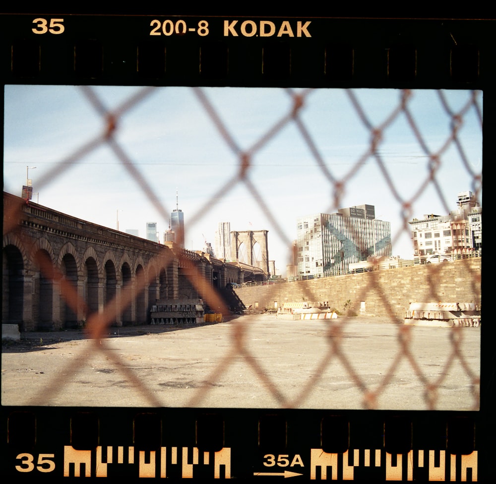 gray chain link fence near brown concrete building