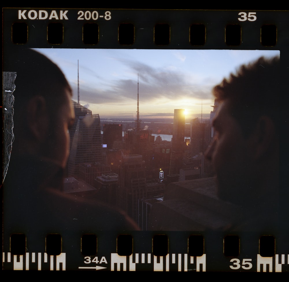 man and woman standing near building during daytime