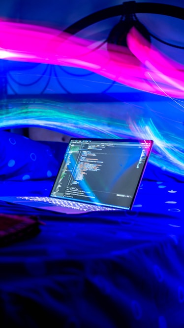 A confident student solving math problems on a laptop with blue electric highlights around the screen.