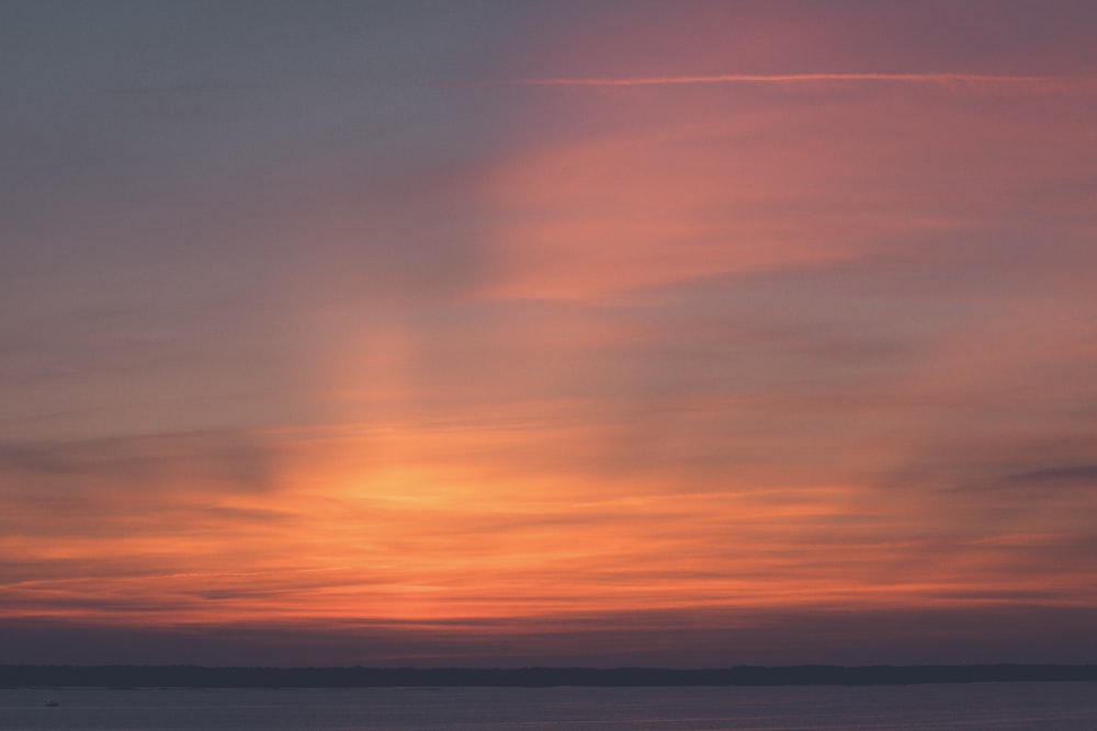 orange and blue sky during sunset