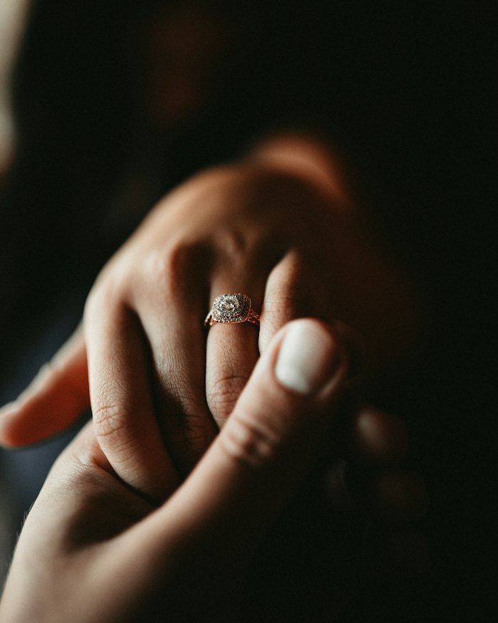 Hand wearing a diamond ring