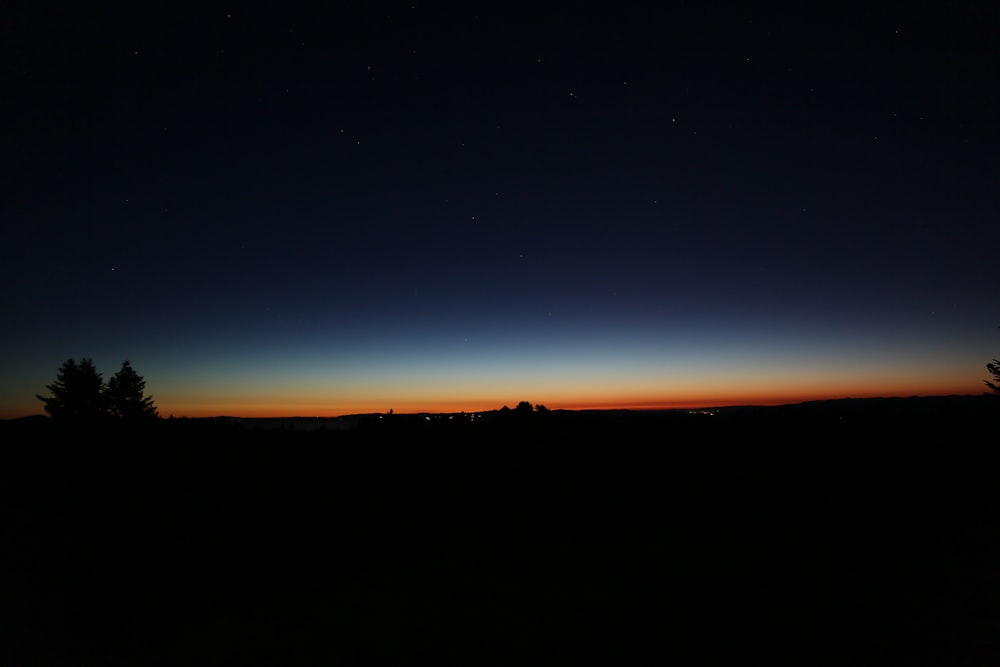 silhouette of mountain during sunset