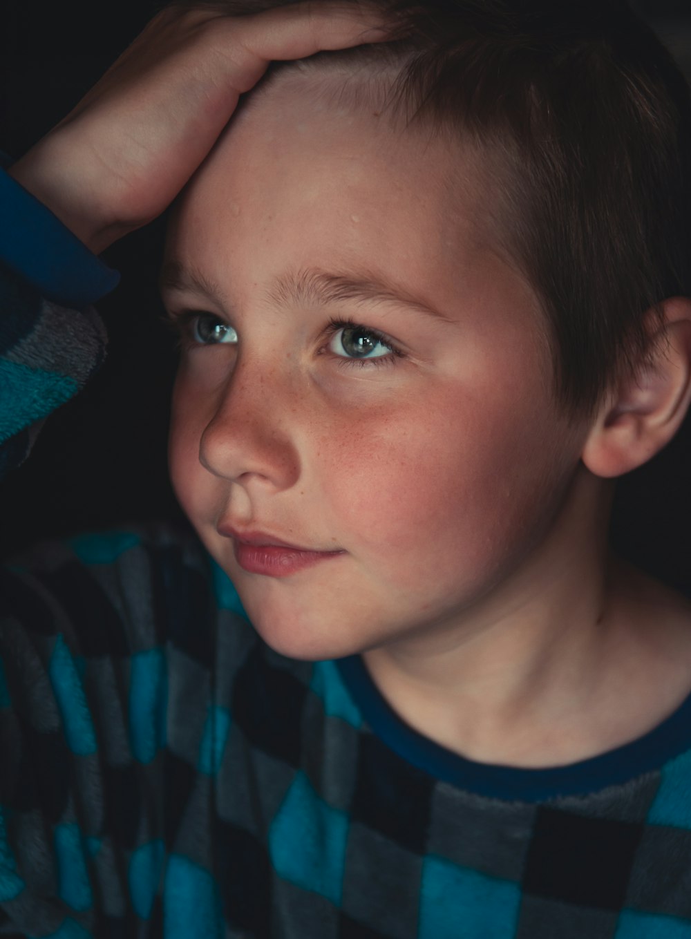 boy in blue and black crew neck shirt