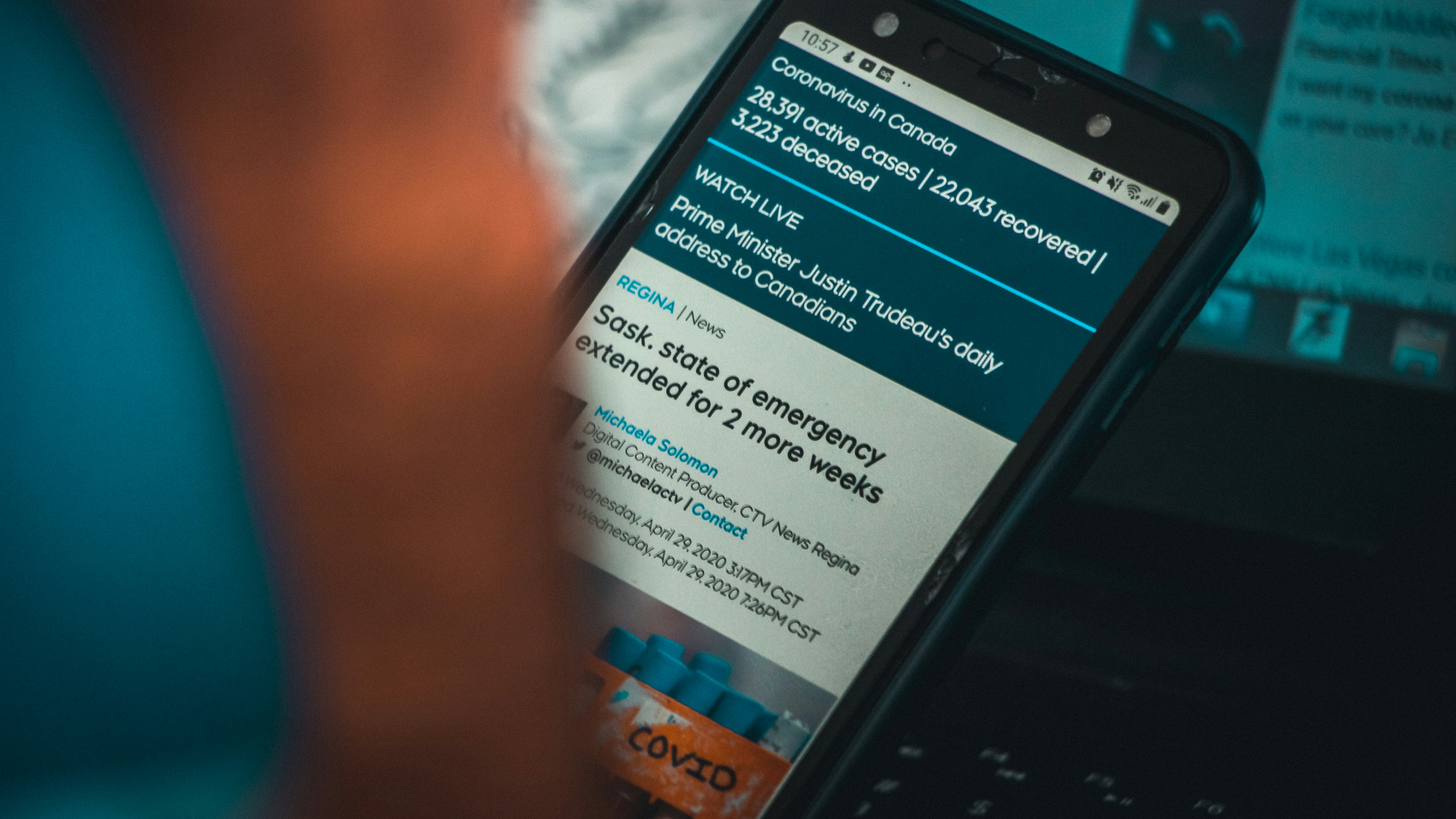 a person holding a cell phone in their hand