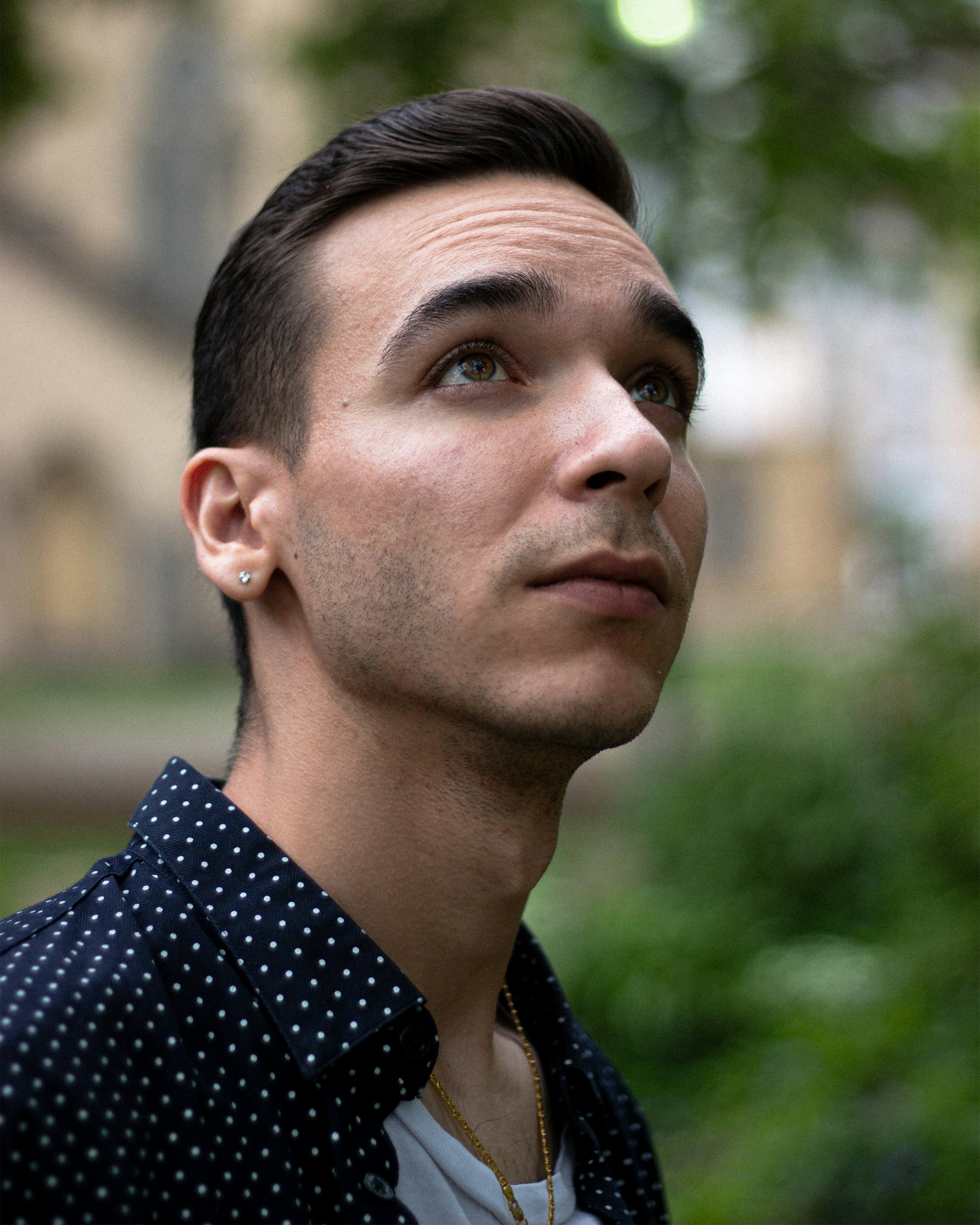 man in black and white polka dot shirt