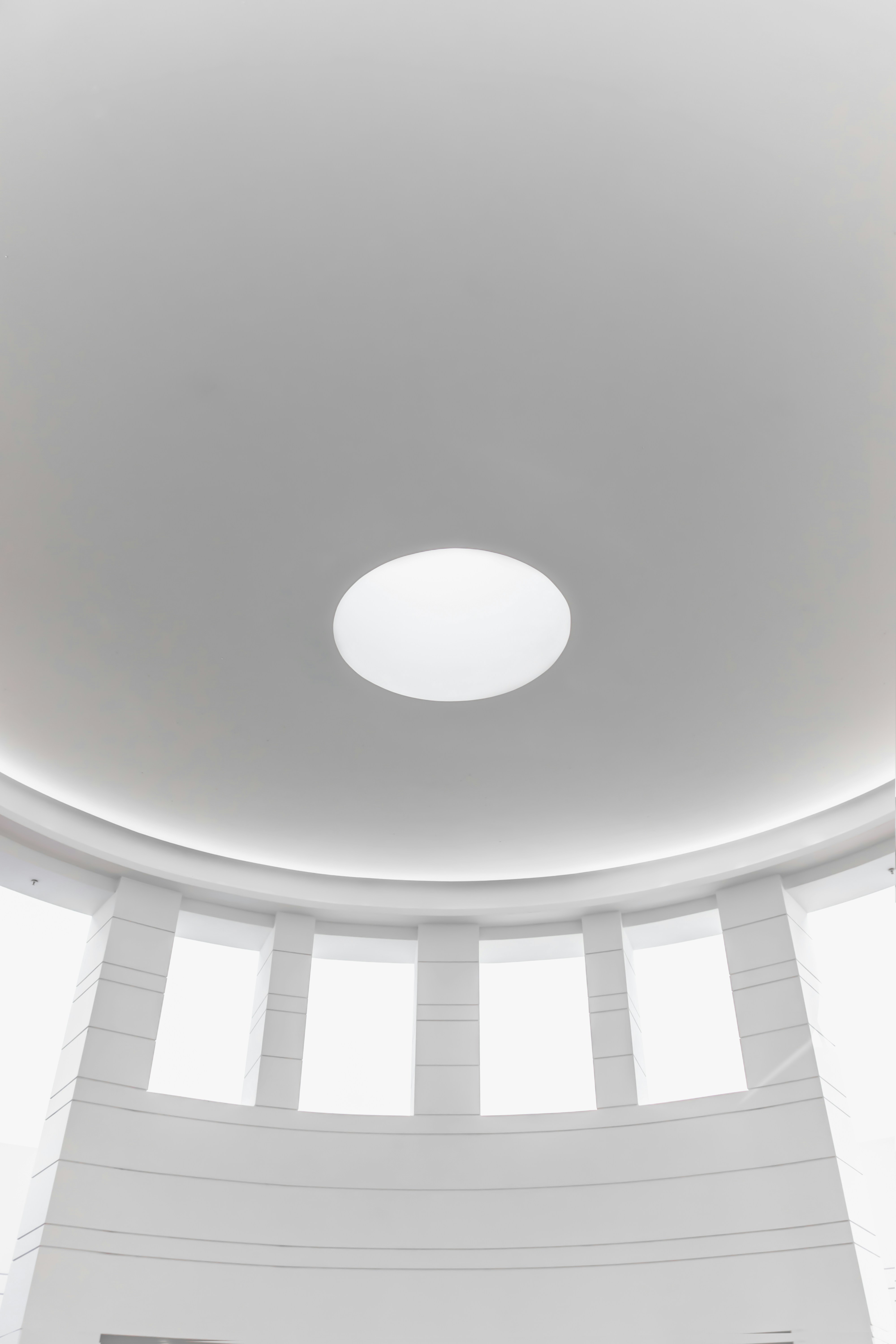 white round ceiling with white ceiling