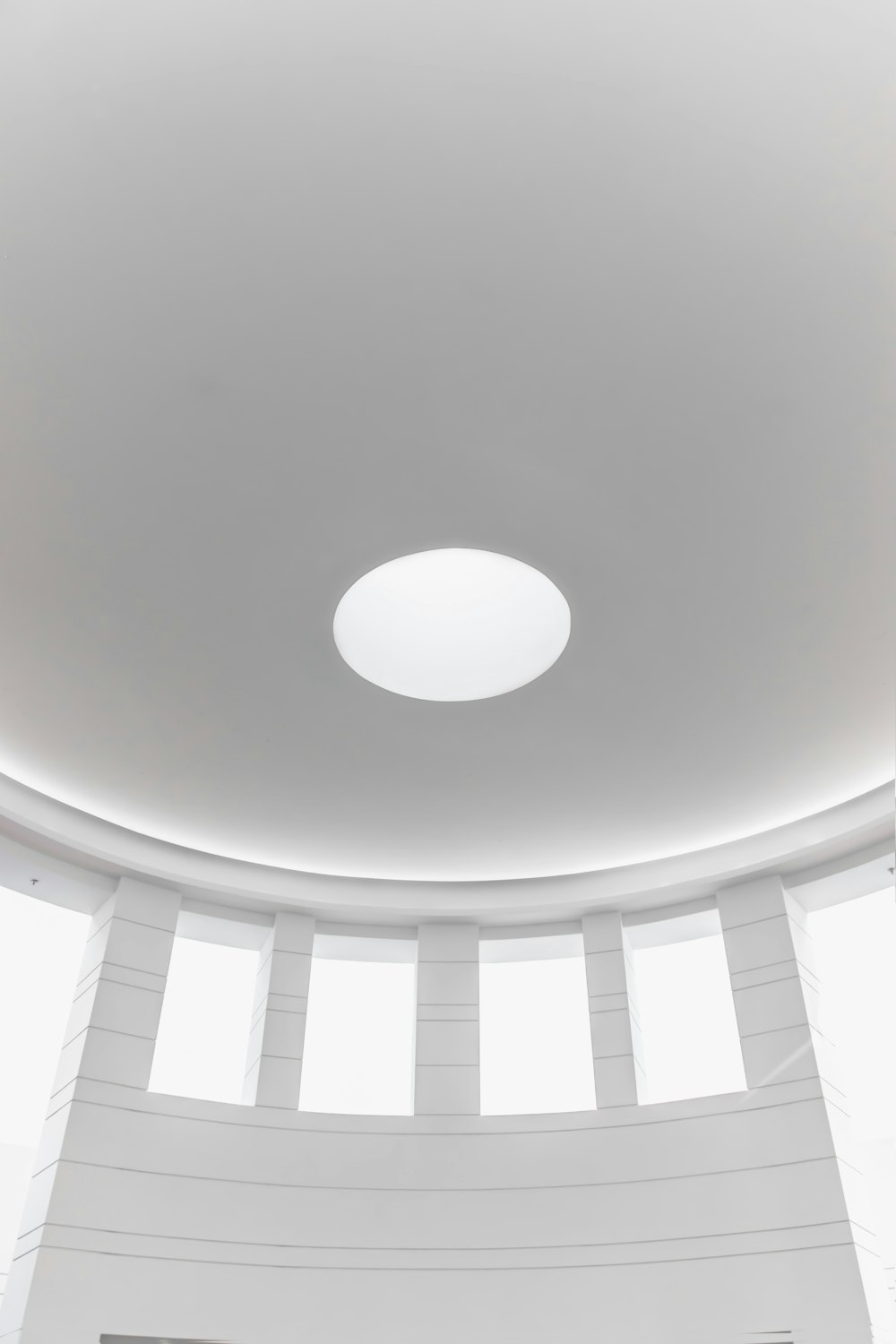 white round ceiling with white ceiling