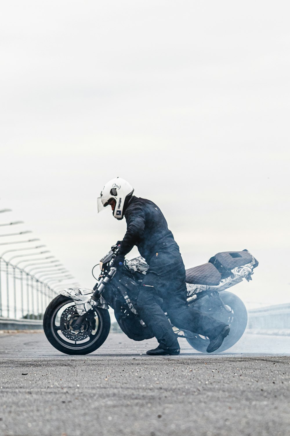 man in black leather jacket riding motorcycle