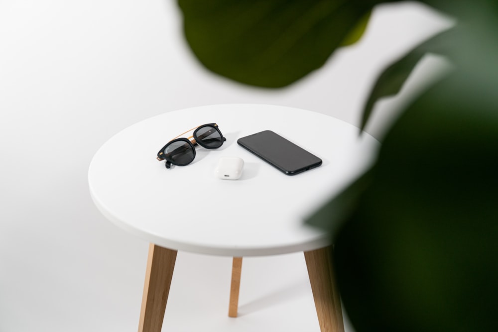 silver iphone 6 on white table