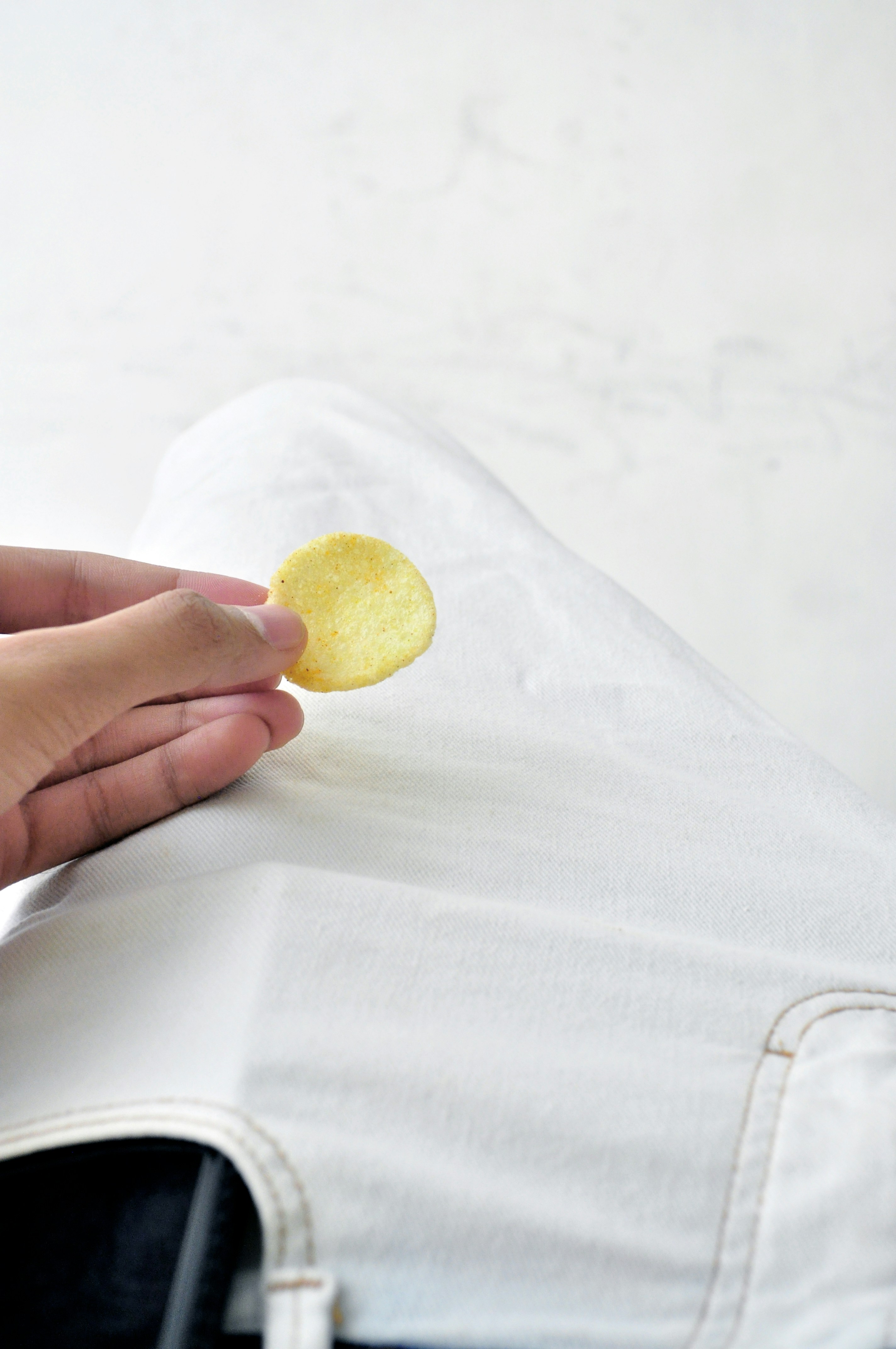 person holding yellow lemon fruit