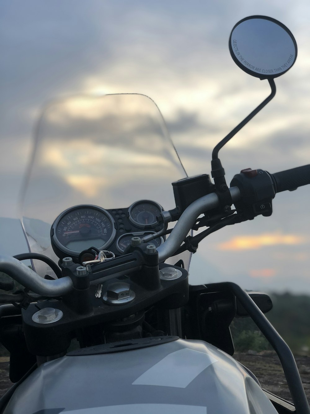 black motorcycle with light during sunset
