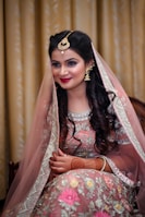 woman in white and red floral dress wearing gold crown