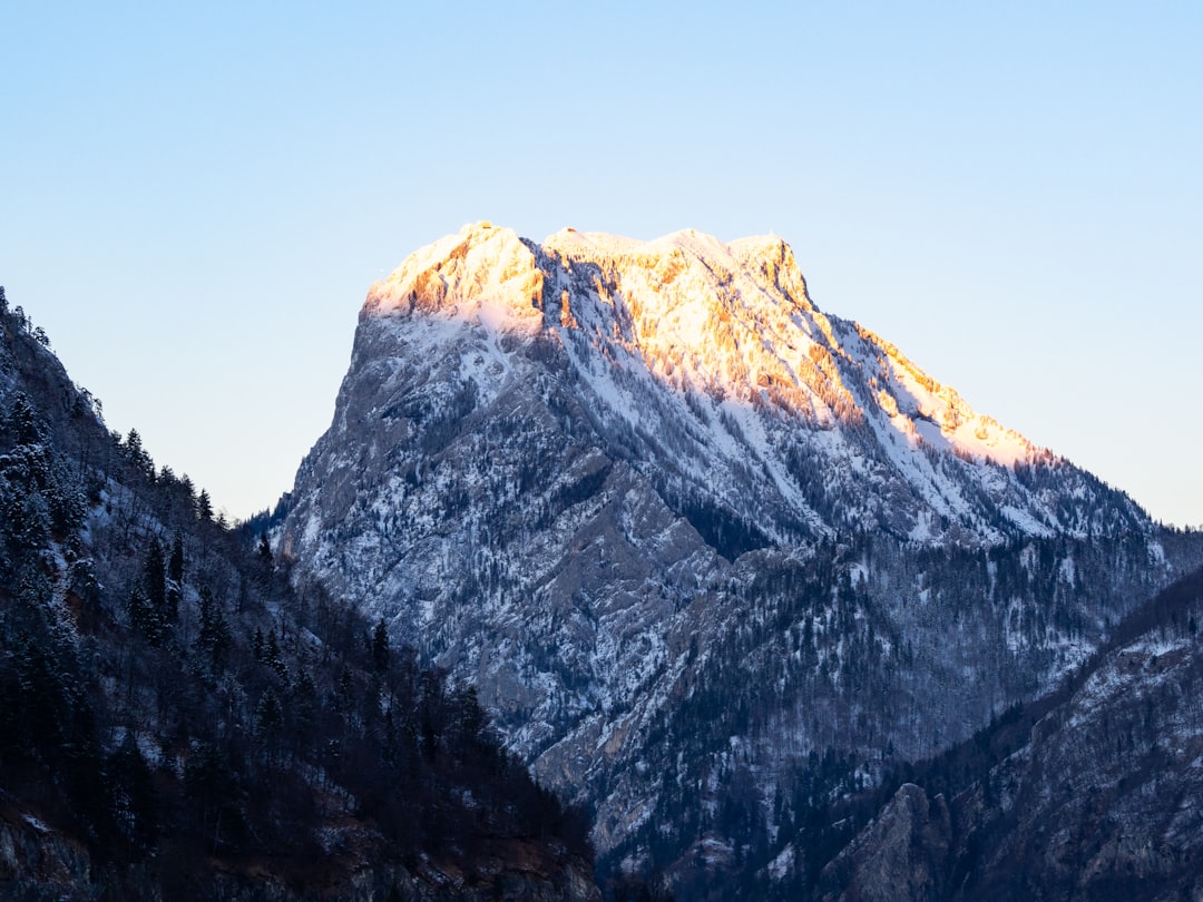 snow covered mountain under blue sky during daytime