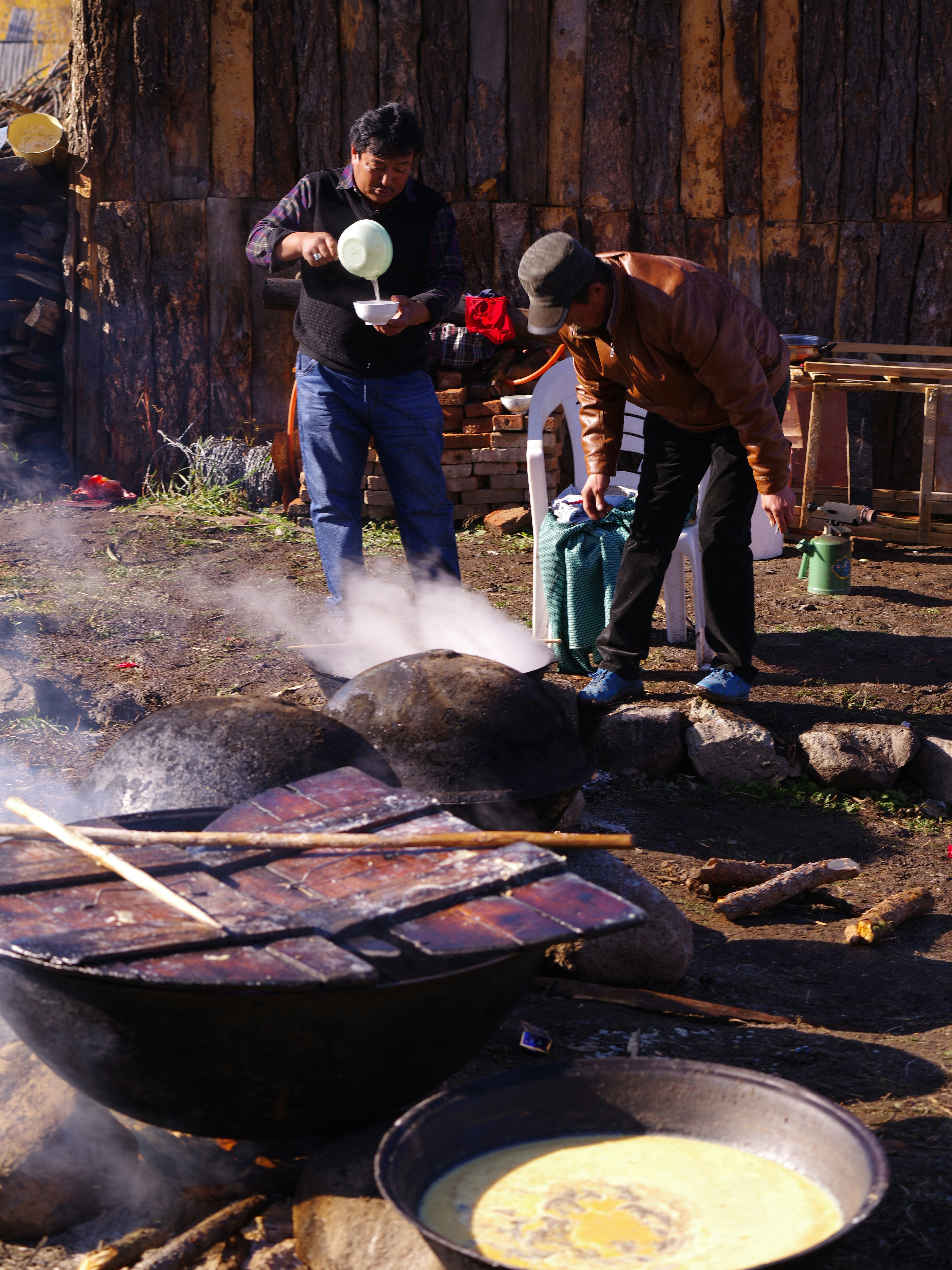 Professional cleaning team working on a barbecue grill