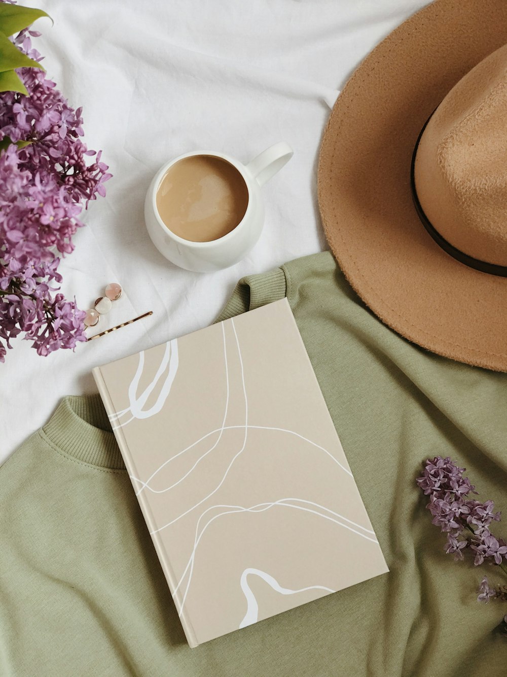 brown fedora hat on white paper