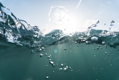 water drops on green surface wave zoom background