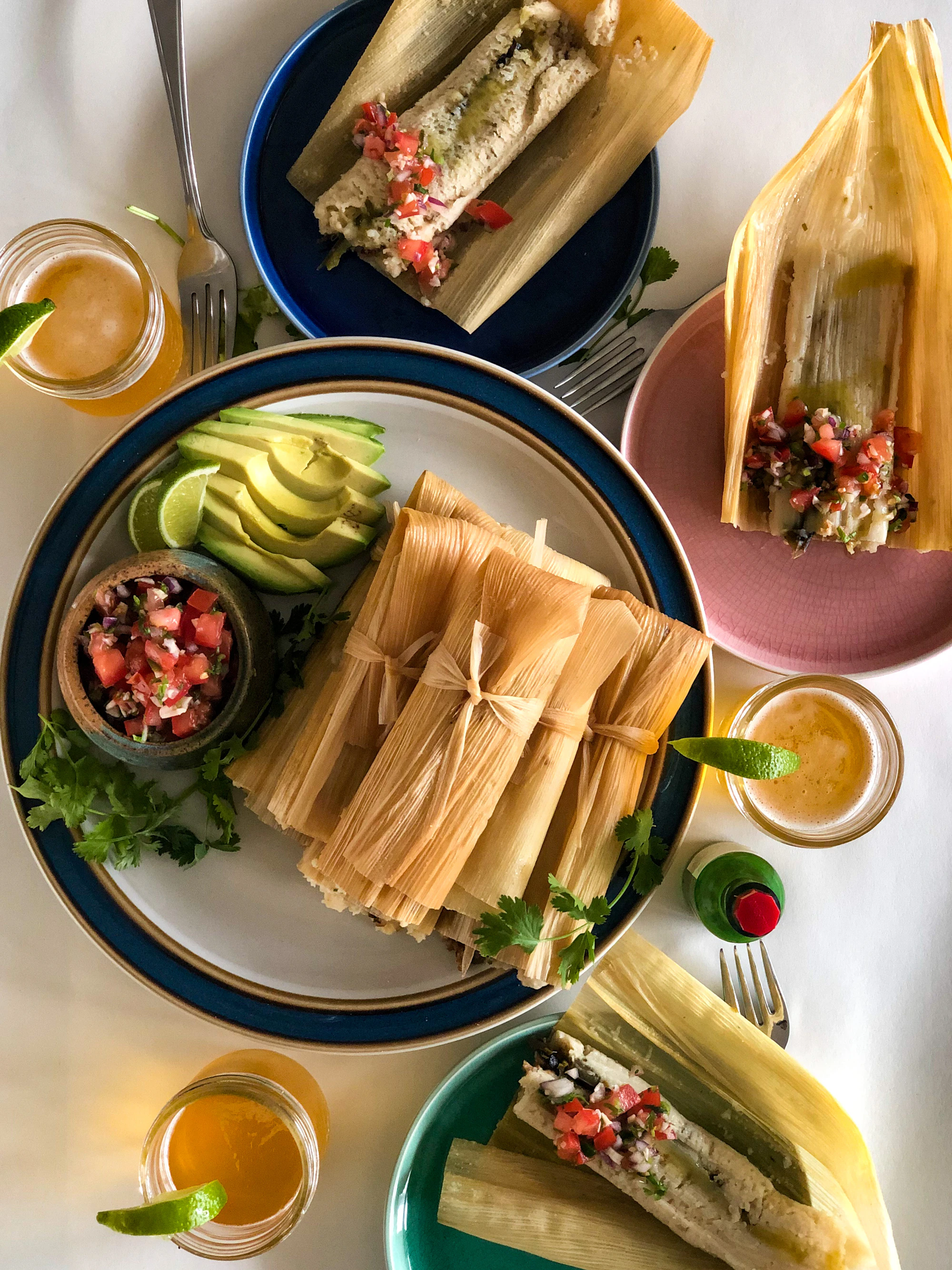 Freshly steamed tamales wrapped in corn husks