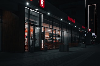 black and brown store front during night time