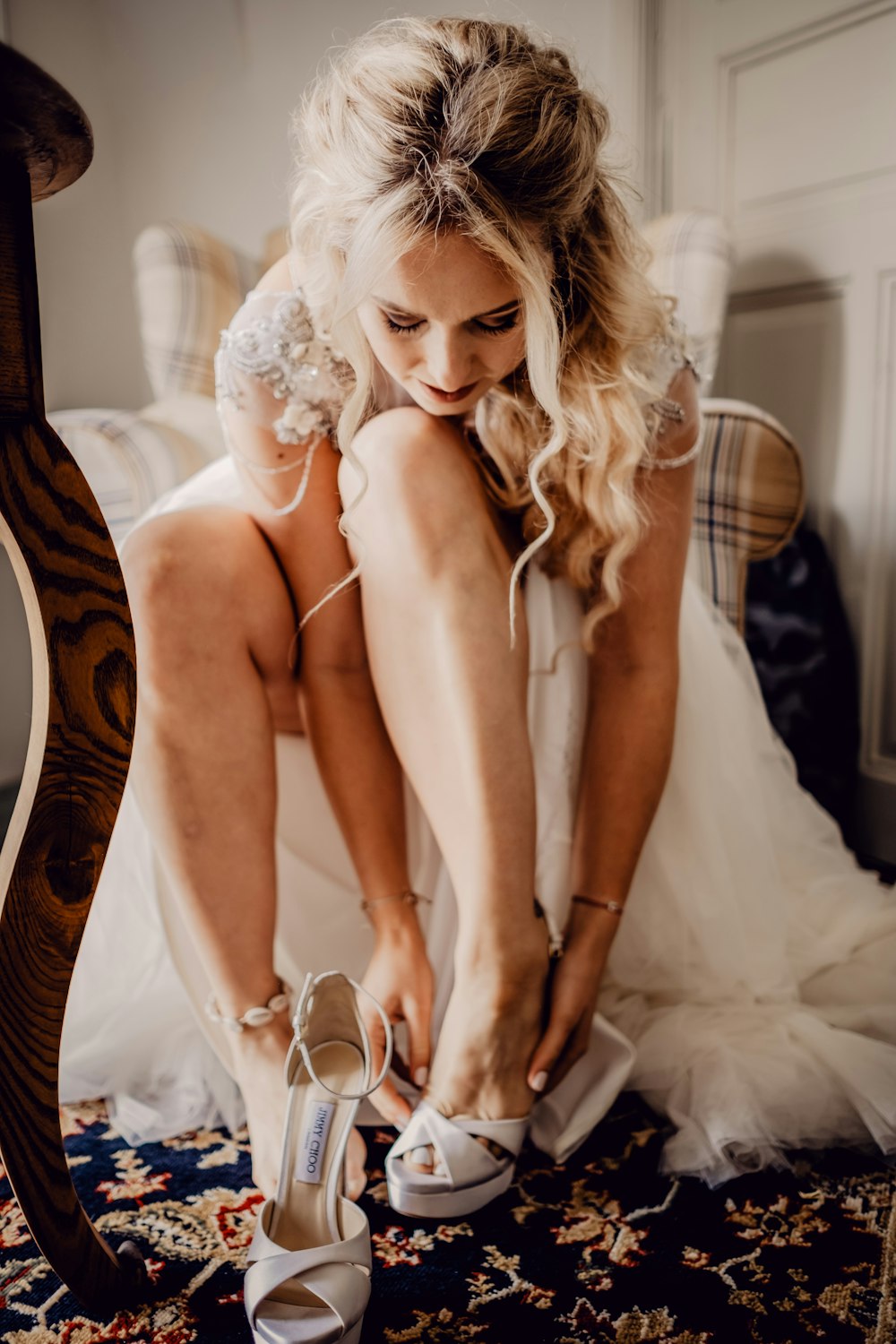 woman in white lingerie sitting on bed