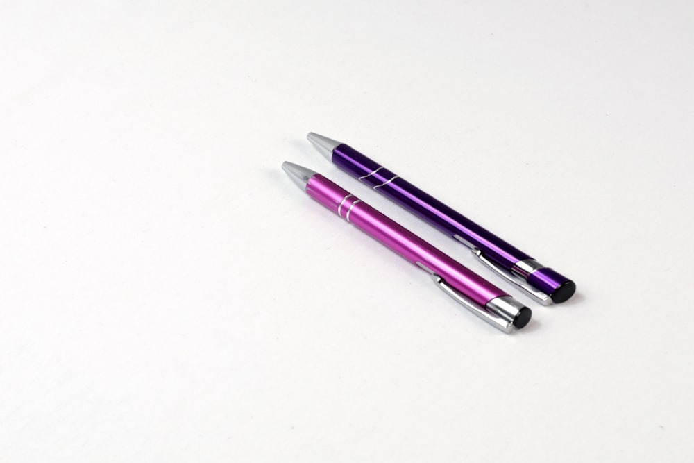 purple and white click pen