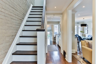 white wooden door near staircase