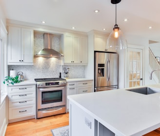 white wooden kitchen cabinet and white kitchen counter