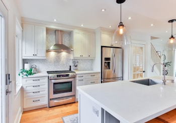 white wooden kitchen cabinet and white kitchen counter