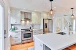 white wooden kitchen cabinet and white kitchen counter