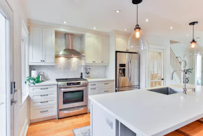 white wooden kitchen cabinet and white kitchen counter