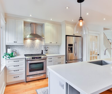 white wooden kitchen cabinet and white kitchen counter