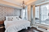 Stylish bedroom with plush bedding and sophisticated design.