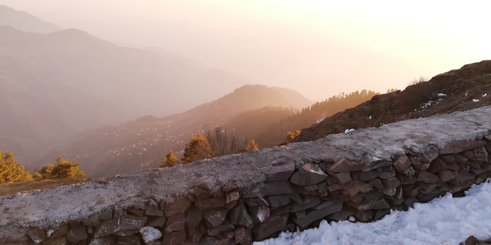 gray rocks on snow covered ground during daytime