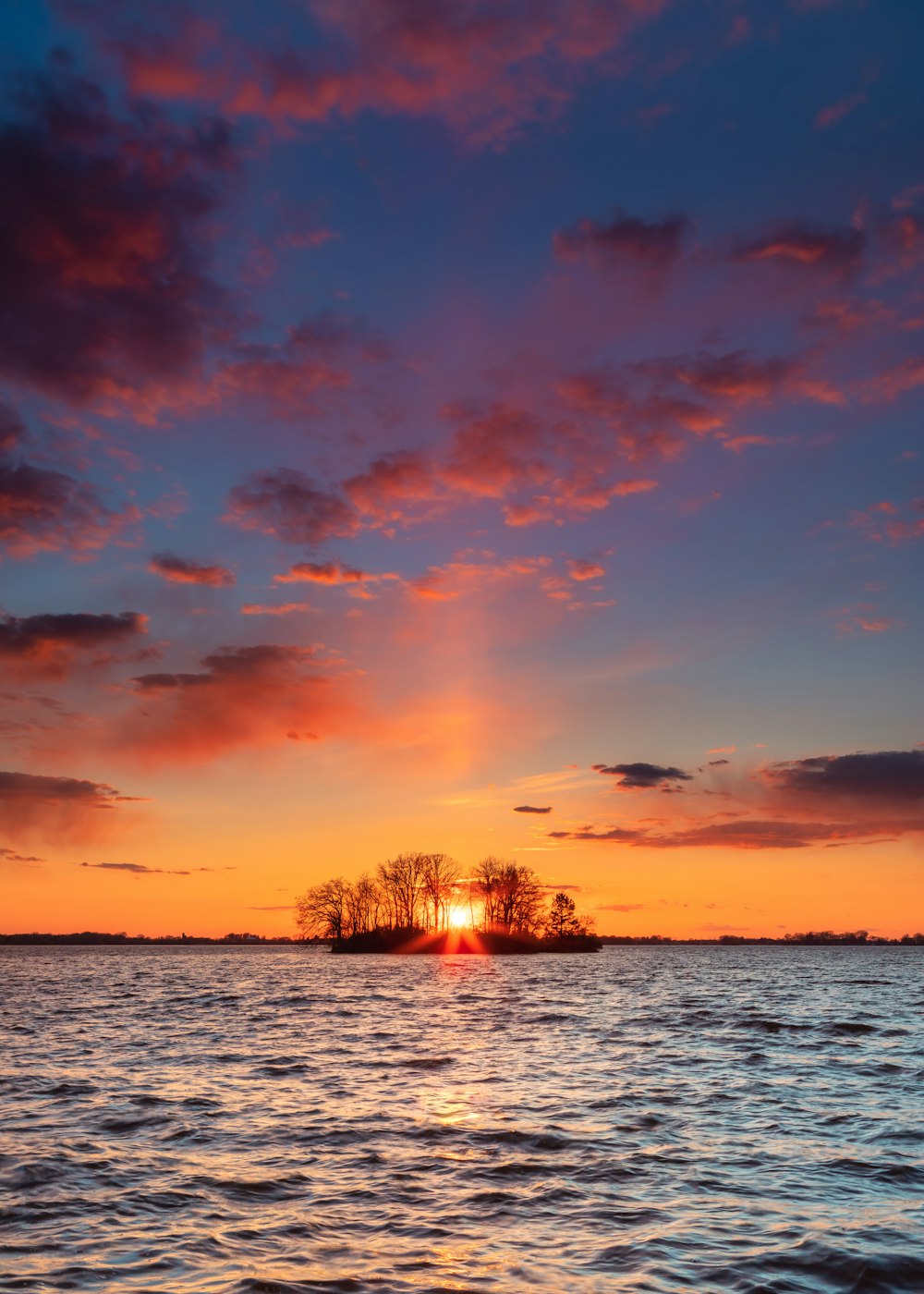 body of water during sunset