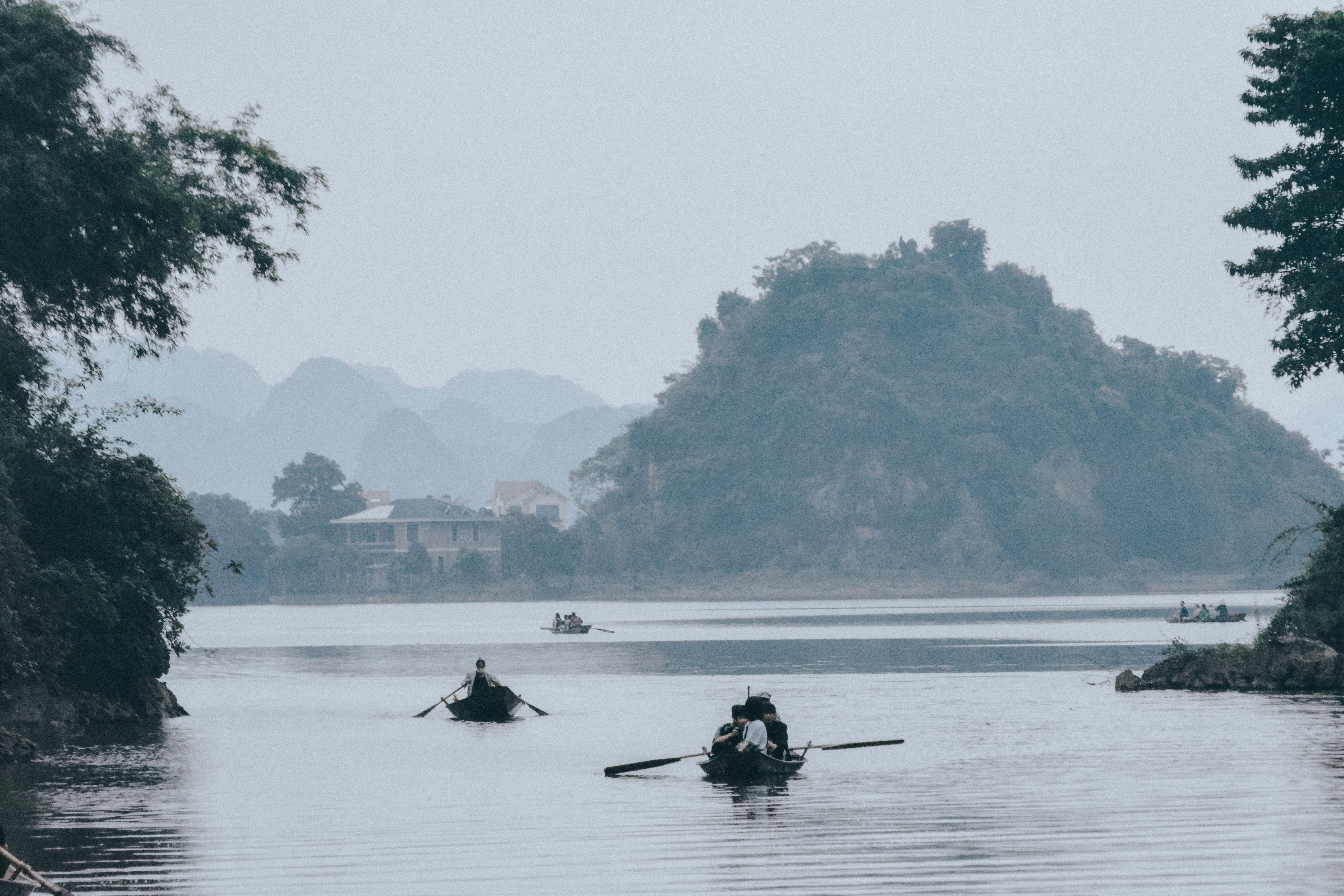 person riding on boat on lake during daytime