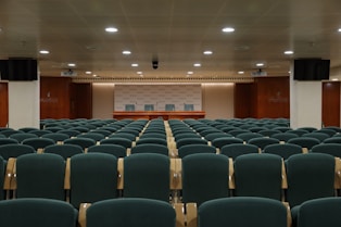 black chairs inside white room