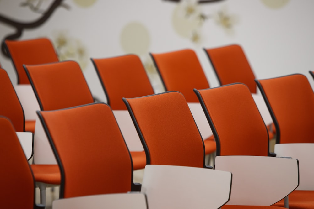 orange chairs in white room