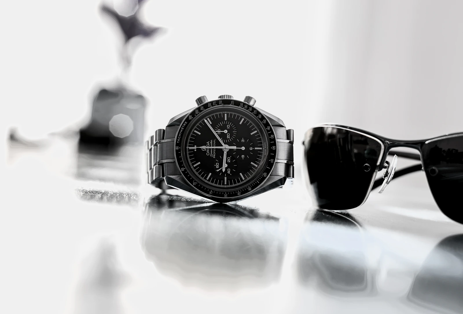 Omega Speedmaster on white reflective surface
