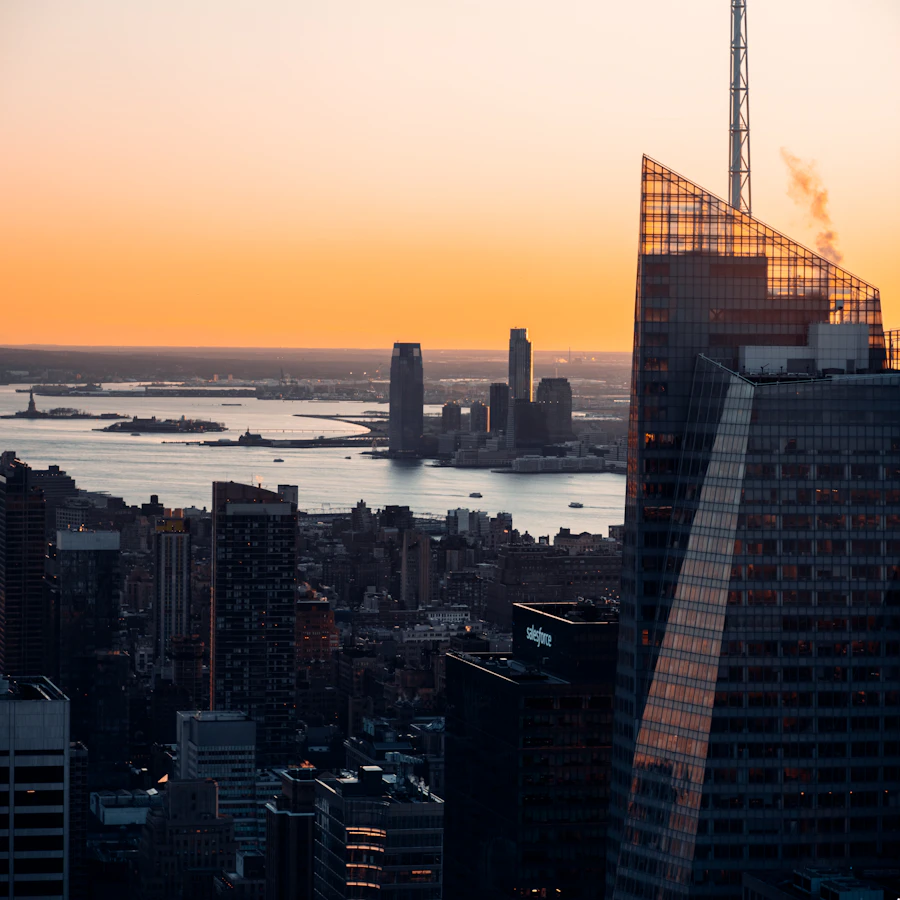 Manhattan skyline across the water in warm light