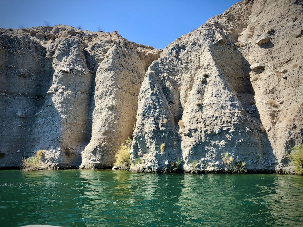 brown rock formation on sea during daytime