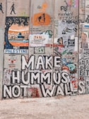 The separation wall with graffiti and messages of resistance painted by locals.