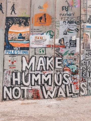 A powerful image of the separation wall covered in graffiti and messages of hope.