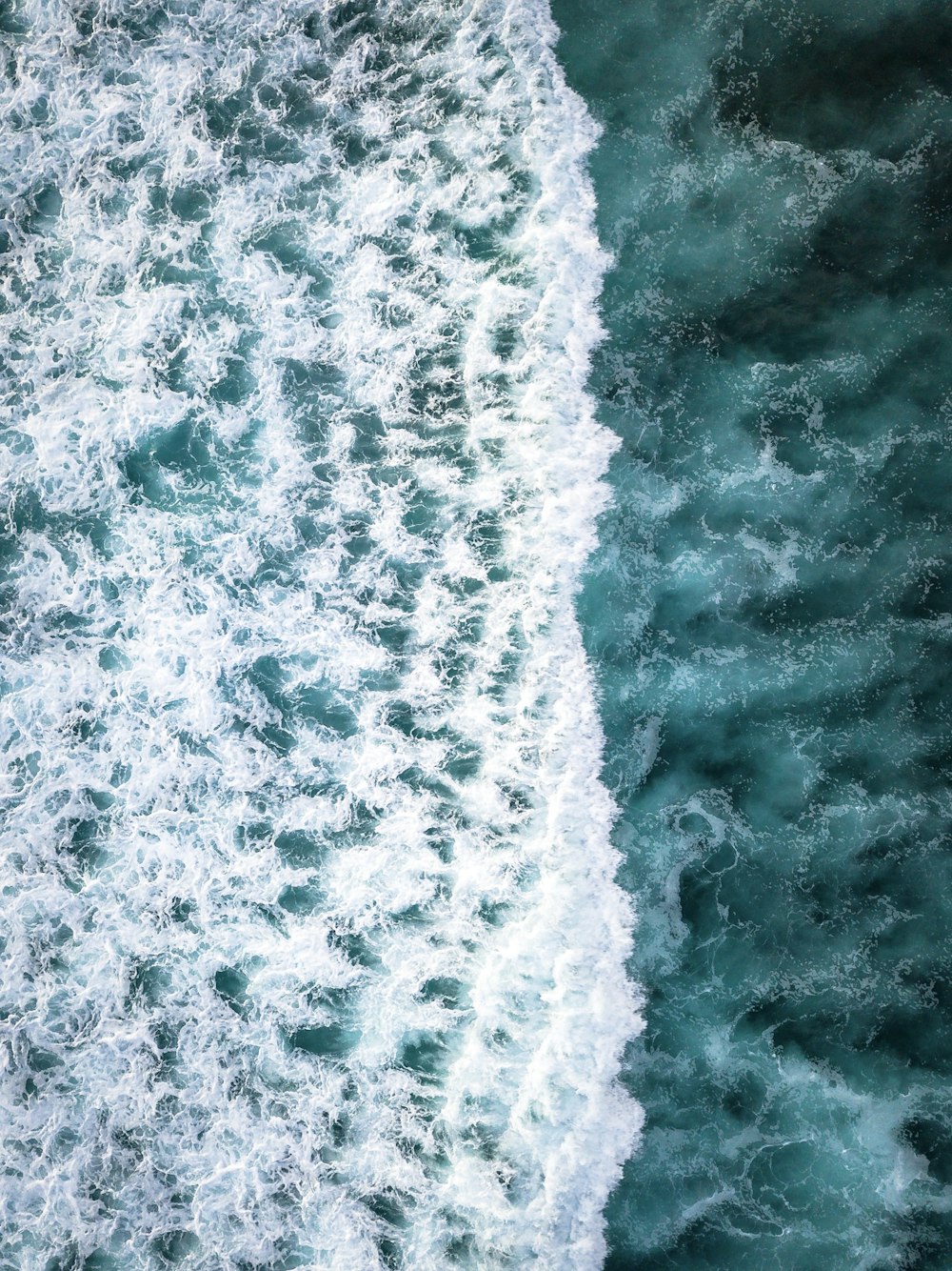 white and blue ocean waves