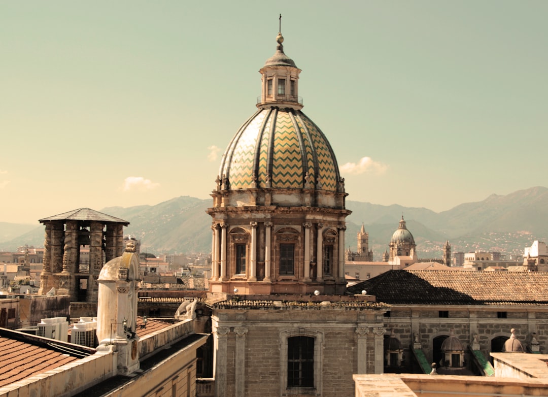 brown and white concrete building during daytime, Palermo, Italy - Sicily<p></figure>