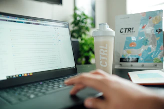 person using black laptop computer
