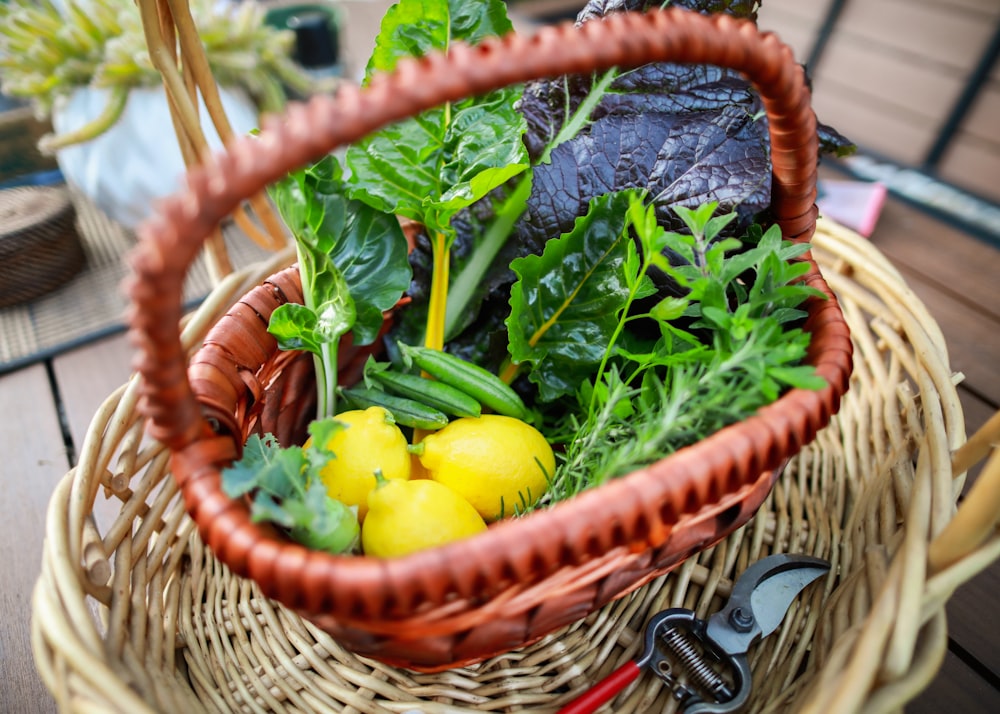 yellow round fruit on brown woven basket