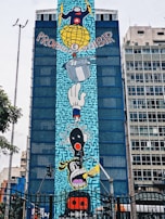An artist painting a colorful mural representing the spirit of Porto Alegre.