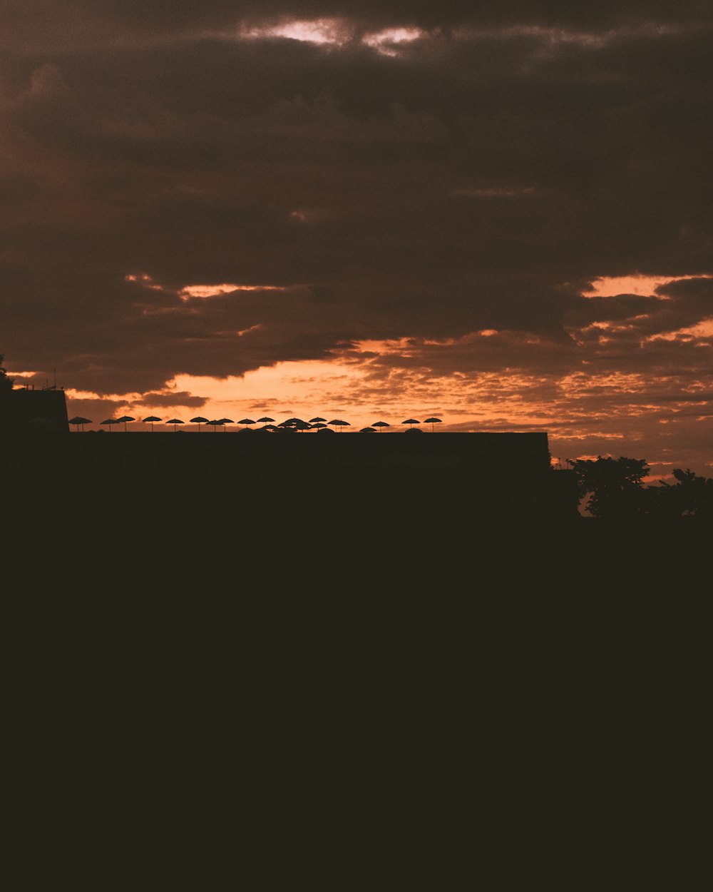 silhouette of building during sunset